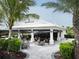 Outdoor bar with seating and tropical landscaping at 14608 Derna Ter, Bradenton, FL 34211
