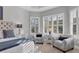 Main bedroom sitting area with two armchairs and window seating at 14608 Derna Ter, Bradenton, FL 34211