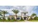 Modern community building with landscaping and palm trees at 14608 Derna Ter, Bradenton, FL 34211