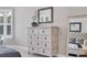 White dresser with six drawers and antique mirror at 14608 Derna Ter, Bradenton, FL 34211