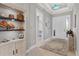 Bright entryway with built-in shelving and view to additional rooms at 14608 Derna Ter, Bradenton, FL 34211
