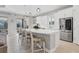 Modern kitchen with white cabinets, stainless steel appliances, and island at 14608 Derna Ter, Bradenton, FL 34211