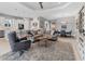 Spacious living room with sectional sofa, large TV, and wood coffee table at 14608 Derna Ter, Bradenton, FL 34211