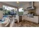 Summer kitchen with grill, fridge, and ample counter space at 14608 Derna Ter, Bradenton, FL 34211