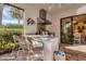 Outdoor kitchen with granite countertop, grill, and seating area at 14608 Derna Ter, Bradenton, FL 34211