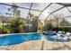Resort-style pool and spa with a screened enclosure at 14608 Derna Ter, Bradenton, FL 34211