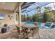 Covered patio area with table and chairs near the pool at 14608 Derna Ter, Bradenton, FL 34211
