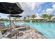 Pool area with lounge chairs and umbrellas at 14608 Derna Ter, Bradenton, FL 34211
