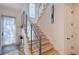 Bright staircase with glass railing leading to the second floor at 1529 Oak St, Sarasota, FL 34236