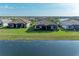 Backyards with screened patios facing the lake at 15917 Clear Skies Pl, Lakewood Ranch, FL 34211