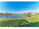 Lush backyard leading to a peaceful lake at 15917 Clear Skies Pl, Lakewood Ranch, FL 34211