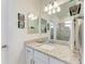 Bright bathroom with granite counters, dual vanity and walk-in shower at 15917 Clear Skies Pl, Lakewood Ranch, FL 34211