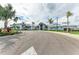 Beautiful neighborhood clubhouse featuring well-manicured landscaping and ample parking at 15917 Clear Skies Pl, Lakewood Ranch, FL 34211