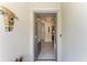 Open front door showcasing the foyer and tile flooring, with a view into the living room at 15917 Clear Skies Pl, Lakewood Ranch, FL 34211
