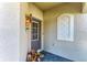 Inviting front entrance with a decorative door and accents, plus decorative flowers at 15917 Clear Skies Pl, Lakewood Ranch, FL 34211
