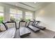 Well-equipped gym with treadmills facing windows with beautiful views at 15917 Clear Skies Pl, Lakewood Ranch, FL 34211