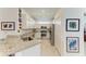 Bright kitchen with white cabinets, stainless steel appliances, and granite countertops at 15917 Clear Skies Pl, Lakewood Ranch, FL 34211