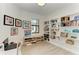 Home office with modern decor, built-in shelving and natural light at 15917 Clear Skies Pl, Lakewood Ranch, FL 34211