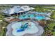 A beautiful community with a pool, splashpad, palm trees, and plenty of space for outdoor fun and relaxation at 15917 Clear Skies Pl, Lakewood Ranch, FL 34211