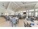 Upscale restaurant in the clubhouse with a full bar and walls of windows at 15917 Clear Skies Pl, Lakewood Ranch, FL 34211