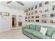 Cozy sitting area with floral sofa, pictures and through way to dining area at 15917 Clear Skies Pl, Lakewood Ranch, FL 34211