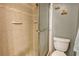 Large shower with tile surround and glass door at 1651 Beach Rd # 408, Englewood, FL 34223