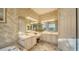 Spacious bathroom with double vanity and corner shower at 1712 Grande Park Dr, Englewood, FL 34223