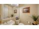 Small bathroom with a single vanity, toilet, and mirror at 1712 Grande Park Dr, Englewood, FL 34223