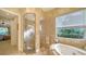 Bathroom features a large shower, garden tub, and views at 1712 Grande Park Dr, Englewood, FL 34223