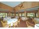 Clubhouse dining room with wood accents and golf course views at 1712 Grande Park Dr, Englewood, FL 34223