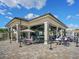 Outdoor community clubhouse with seating and a bar at 17459 Hickok Belt Loop, Bradenton, FL 34211