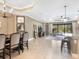 Open concept dining area with view into living room and kitchen at 17459 Hickok Belt Loop, Bradenton, FL 34211