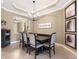 Elegant dining room featuring a dark wood table and six gray chairs at 17459 Hickok Belt Loop, Bradenton, FL 34211