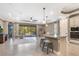 Open concept kitchen with island and views into the living and dining areas at 17459 Hickok Belt Loop, Bradenton, FL 34211