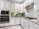 Well-equipped kitchen with stainless steel appliances and granite countertops at 17459 Hickok Belt Loop, Bradenton, FL 34211
