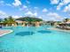 Resort-style pool with large umbrellas and plenty of lounge chairs at 17459 Hickok Belt Loop, Bradenton, FL 34211