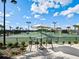 Tennis courts with seating area overlooking the game at 17459 Hickok Belt Loop, Bradenton, FL 34211