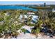 Single Gathering home with lush landscaping and private dock at 18 N Casey Key Rd, Osprey, FL 34229