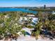 Property boasts waterfront access and lush landscaping at 18 N Casey Key Rd, Osprey, FL 34229