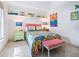 Bright bedroom with a comfortable bed and colorful decor at 18 N Casey Key Rd, Osprey, FL 34229