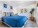 Guest bedroom with blue bedding and coastal-themed artwork at 18 N Casey Key Rd, Osprey, FL 34229