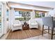 Bright kitchen nook with water views, comfortable seating and natural light at 18 N Casey Key Rd, Osprey, FL 34229