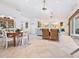 Bright living area with white walls and a dining table at 18 N Casey Key Rd, Osprey, FL 34229