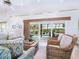 Relaxing living room featuring a view of the pool at 18 N Casey Key Rd, Osprey, FL 34229