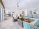 Spacious living room with tile floors and wicker furniture at 18 N Casey Key Rd, Osprey, FL 34229