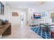 Living room features coastal decor, hardwood floors and access to other rooms at 18 N Casey Key Rd, Osprey, FL 34229