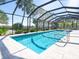 Inviting screened pool with ample surrounding space at 18 N Casey Key Rd, Osprey, FL 34229