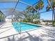 Refreshing screened pool perfect for outdoor enjoyment at 18 N Casey Key Rd, Osprey, FL 34229