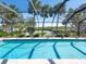 Relaxing screened pool overlooking lush landscaping at 18 N Casey Key Rd, Osprey, FL 34229
