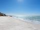 Scenic white sand beach with clear blue ocean in the background at 18 N Casey Key Rd, Osprey, FL 34229